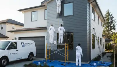 Professional siding painters in Columbus, OH applying durable exterior paint for home protection